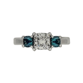PLATINUM 1.08CT F VS1 CUSHION SET IN A PAST, PRESENT AND FUTURE MOUNTING WITH TWO ROUND LABORATORY GROWN ALEXANDRITES CERTIFIED BY GIA #5234160482 FOR CUSHION  AND GIA #2231160642 FOR ROUND ALEXANDRITES